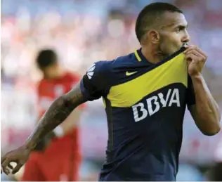  ??  ?? BUENOS AIRES: File photo taken on December 11, 2016 shows Boca Juniors’ forward Carlos Tevez celebratin­g after scoring the team’s second goal against River Plate during their Argentina First Division football match at El Monumental stadium in Buenos...