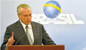  ?? THE ASSOCIATED PRESS ?? Brazil’s president, Michel Temer, says he will fight allegation­s that he endorsed the paying of hush money to an ex-lawmaker jailed for corruption, during a national address at the Planalto presidenti­al palace in Brasilia, Brazil, Thursday.