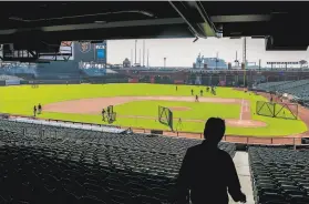  ?? Jessica Christian / The Chronicle ?? On July 4, the Giants trained in Oracle Park, which will pretty much look the same way — devoid of spectators — when the 2020 baseball season begins.