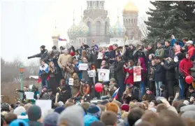  ?? AP FOTO / DMITRI LOVETSKY ?? DEFIANT. Protesters gather at Marsivo Field in St. Petersburg, Russia for an unsanction­ed protest against the Russian government, the biggest gathering in a wave of nationwide protests that were the most extensive show of defiance in years.