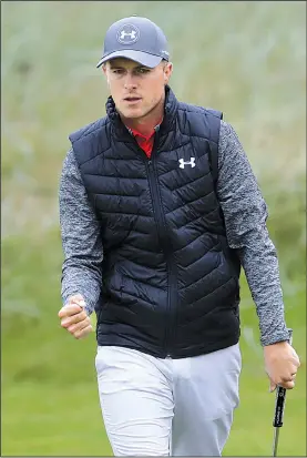  ?? AP/PETER MORRISON ?? Jordan Spieth missed five fairways over the first seven holes, but he rebounded to finish with a 5-under 65 to grab a share of the lead with Brooks Koepka and Matt Kuchar after the opening round of the British Open on Thursday at Royal Birkdale Golf...