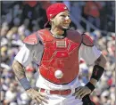  ??  ?? A ball stuck on Cardinals catcher Yadier Molina’s chest protector set the stage for the Cubs’ comeback victory Thursday.