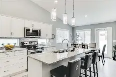  ??  ?? North Ridge partnered with Superior Kitchens to design the chef-worthy kitchens at Highlander Ridge II. Six different colour palettes are available.