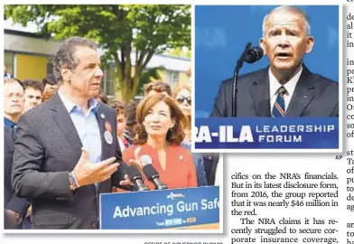 ?? AP OFFICE OF GOVERNOR CUOMO ?? Gov. Cuomo (pictured with Lt. Gov. Kathy Hochul) scoffed at claims his policies are crippling the NRA. Inset, Former Lt. Col. Oliver North speaks at NRA conference in May.