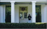  ?? EVAN VUCCI — THE ASSOCIATED PRESS ?? A Marine is posted on Wednesday outside the West Wing of the White House in Washington, signifying the president is in the Oval Office.