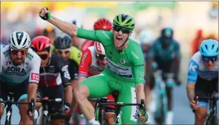  ??  ?? The iconic image of Sam Bennett crossing the line, winning the Paris stage.