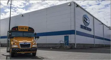  ?? MATTHEW PEARSON/WABE VIA AP ?? An all-electric school bus sits on display in front of the Blue Bird Corp. factory in Fort Valley. Workers last week voted to be represente­d by the United Steelworke­rs union.