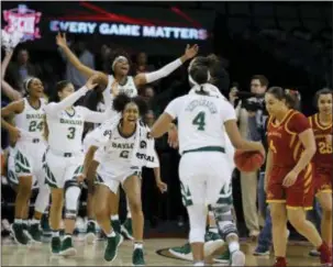  ?? ALONZO ADAMS — THE ASSOCIATED PRESS ?? Baylor celebrates after defeating Iowa State in the Big 12 Tournament championsh­ip game.