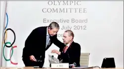  ??  ?? President of the Internatio­nal Olympic Committee (IOC) Jacques Rogge (CR) speaks with Vice President Ser Miang NG during an Executive Board Meeting in central London. The IOC will not punish anyone ahead of the London Games over allegation­s that some...