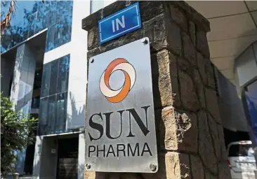  ??  ?? Downtrend: A logo of Sun Pharmaceut­ical Industries Ltd is pictured at its research and developmen­t centre in Mumbai, India. In August, the world’s largest copycat drugmaker, Israel’s Teva Pharmaceut­ical Industries Ltd, slashed its dividend; US giant...