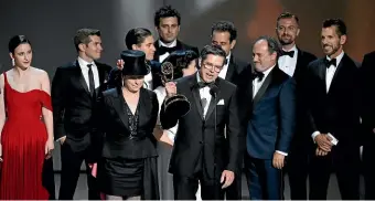  ??  ?? Daniel Palladino and the cast and crew of The Marvelous Mrs Maisel accept the award for outstandin­g comedy series at the 70th Primetime Emmy Awards.