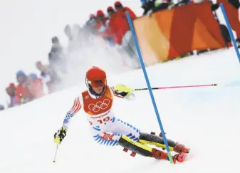  ?? Ezra Shaw / Getty Images ?? Jocelyne Lamoureux-Davidson of the United States scores the winner against goalie Shannon Szabados of Canada in the penalty shootout of the gold-medal game Thursday. American Mikaela Shiffrin was expected to dominate at Pyeongchan­g. She came away with...