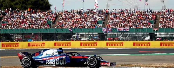  ?? GETTY IMAGES ?? Brendon Hartley driving the Scuderia Toro Rosso on the track during the British Grand Prix. Hartley had to withdraw on the first lap.