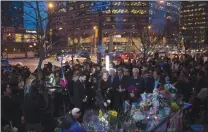  ?? CP PHOTO CHRIS YOUNG ?? Mourners gather for a vigil organized by the Korean Canadian Cultural Associatio­n in Toronto on Friday. After four days of painstakin­g "scientific" efforts to identify the victims of a horrific attack in Toronto, authoritie­s released on Friday the...