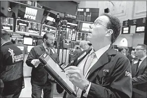  ?? AP/RICHARD DREW ?? Trader Joseph Murray works Thursday on the floor of the New York Stock Exchange.