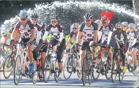  ?? Picture: BRENTON GEACH ?? PEDAL TO THE METAL: Cape Town Cycle Tour competitor­s make their way past the fountain in Adderley Street yesterday. Nearly 34 000 cyclists took part in the annual event.