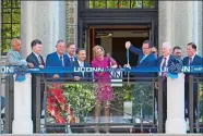  ?? PAT EATON-ROBB/AP PHOTO ?? University of Connecticu­t President Susan Herbst and Connecticu­t Gov. Dannel P. Malloy cut the ribbon on the school’s new downtown Hartford campus on Wednesday in Hartford. UConn students and faculty are scheduled to begin classes Monday in the capital...