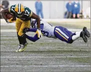  ?? GETTY IMAGES ?? Terence Newman, in his previous job as a cornerback with the Vikings, takes down Packers receiver Davante Adams in a game at Lambeau Field in 2016. Newman now coaches defensive backs for the Vikings, bringing 15 years of playing experience to the task.