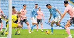  ?? AFP ?? City's Gabriel Jesus (2R) scores the solitary goal against Sheffield in their Premier League match.