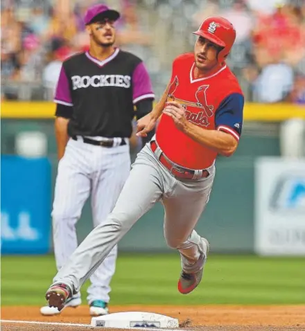  ?? Dustin Bradford, Getty Images ?? St. Louis shortstop Paul DeJong rounds third base to score one of six first-inning runs for the Cardinals against the Rockies at Coors Field on Saturday.