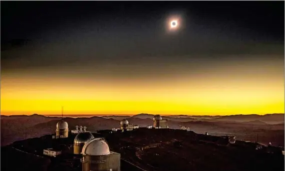  ?? MARTIN BERNETTI/AFP ?? A rare total solar eclipse as seen from the La Silla European Southern Observator­y in La Higuera, Chile, on Tuesday. Tens of thousands of tourists braced for the event that turned day into night along a large swath of Latin America’s southern cone.