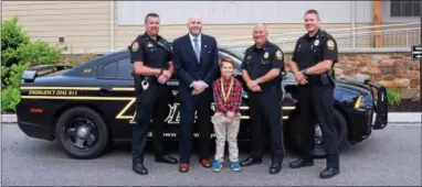  ?? SUBMITTED PHOTO ?? Pictured from left: Officer Matt Brown, Chester County District Attorney Tom Hogan, Chief Asher Callan, Chief John Narcise and Officer Mark Monroe.