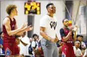  ??  ?? Oklahoma City superstar Russell Westbrook helps coach Team WhyNot — named after his personal mantra — in the EYBL tournament May 12 in Cartersvil­le.