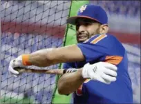  ?? LYNNE SLADKY — THE ASSOCIATED PRESS FILE ?? In this Saturday file photo, New York Mets’ Jose Bautista stretches before a baseball game against the Miami Marlins in Miami. The Philadelph­ia Phillies have acquired veteran slugger Jose Bautista from the New York Mets for a player to be named later or cash, Tuesday.