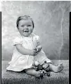  ??  ?? On 1 October 1964, this young girl played with toys while having her picture taken in Joseph Swainson’s studio. Can you help us identify her?