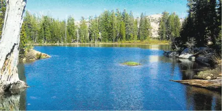  ?? Photos by Tom Stienstra / The Chronicle ?? One of the lakes that give the Five Lakes Trail its name. The trail offers one of the best short hikes in the High Sierra.