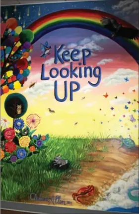  ?? PHOTO COURTESY OF THE MONTGOMERY BAR ASSOCIATIO­N ?? “Keep Looking Up” is the theme of a new mural designed by Skippack artist Chelsea Allen for Montgomery County Court Care facility.