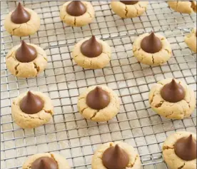  ?? The Associated Press ?? This recipe for Peanut Blossom Cookies appears in the cookbook Perfect Cookie.