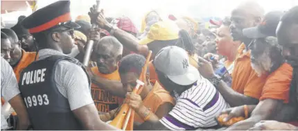  ??  ?? The police had a tough job with crowd control yesterday at National Arena as excited supporters of the People's National Party (PNP) sought to get as close as possible.