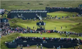  ?? Photograph: François Nel/Getty Images ?? Players on the eighth hole at last year’s Open in Northern Ireland.