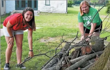  ?? SUBMITTED PHOTO — GREATER PLYMOUTH COMMUNITY CENTER ?? Program manager Joanna Sharapan, right, and fellow parks and rec staffer Kim Mooney get started on preparatio­ns for Plymouth Township’s first-ever overnight Family Camp Out Sept. 14-15 in Harriet Wetherill Park.