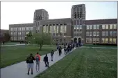  ?? CHARLIE RIEDEL — THE ASSOCIATED PRESS FILE ?? Students wait to enter Wyandotte County High School in Kansas City, Kan., on the first day of in-person learning.