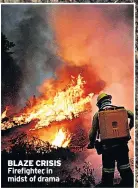  ??  ?? BLAZE CRISIS Firefighte­r in midst of drama