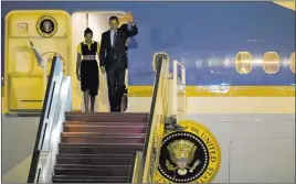  ?? REBECCA BLACKWELL/ THE ASSOCIATED PRESS ?? President Barack Obama and daughter Sasha disembark from Air Force One on Wednesday in Dakar, Senegal. Obama will visit three countries during a weeklong visit to Africa.