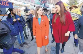  ?? AARON CHOWN/PA ?? Britain’s Liberal Democrat leader Jo Swinson, left, walks with the party’s candidate for Finchley and Golders Green Luciana Berger as she arrives in North London Wednesday.