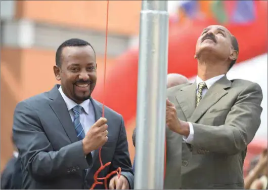  ??  ?? Ethiopian Prime Minister Abiy Ahmed (left) and Eritrean President Isaias Afwerki re-opening the Eritrean embassy in Addis Ababa.