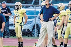  ?? POST-TRIBUNE ?? New Prairie coach Russ Radtke watches the action during a game against Andrean in 2015. Portage has hired Radtke as its coach.