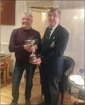  ??  ?? Baltinglas­s Golf Club Winter League winner James Darcy received the cup from Club Captain John Kelly.