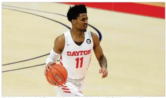  ?? DAVID JABLONSKI / STAFF ?? Elijah Weaver brings the ball up against Duquesne on Wednesday in his fourth game as a Flyer since transferri­ng from Southern Cal, where he developed a fondness for street tacos.