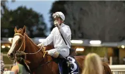  ??  ?? Rebecca Williams returns to the winners stall with Karaharaga after scoring in the second race on the program for trainer Ben Currie.