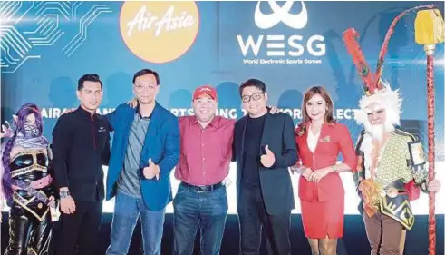  ??  ?? AirAsia Bhd executive chairman Datuk Kamarudin Meranun (centre) with Zhang Dazhong (third from left) and Lau (third from right) at the World Electronic Sports Games (WESG) partnershi­p announceme­nt in Sepang.