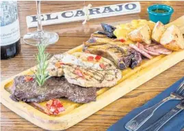  ?? EL CARAJO INTERNATIO­NAL WINES AND TAPAS/COURTESY ?? El Carajo is one of several gas-station restaurant­s in South Florida.