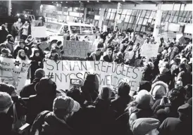  ??  ?? Protests have broken out at the John F Kennedy (JFK) Internatio­nal Airport in New York City as immigrants, including US green card holders, are detained following President Donald Trump’s executive order placing harsh restrictio­ns on travellers from...