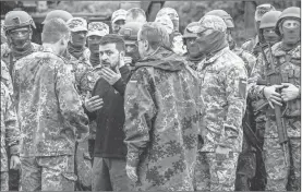  ?? Jens Büttner/pool/getty Images/tns ?? Volodymyr Zelenskyy, president of Ukraine, is seen visiting the training of Ukrainian soldiers on the Patriot anti-aircraft missile system at a training ground on Tuesday, in Mecklenbur­g, Germany.