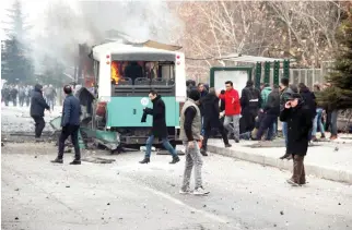  ??  ?? A public burns at the scene of the car bomb attack in central city of Kayseri, Turkey, on Saturday. (AP)