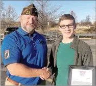  ?? Photograph submitted ?? Chris Snow, commander of the Veterans of Foreign Wars Post 8109, presented a check and letter of appreciati­on to Zach Howe who made and installed a flag drop box near the veterans memorial in downtown Pea Ridge.